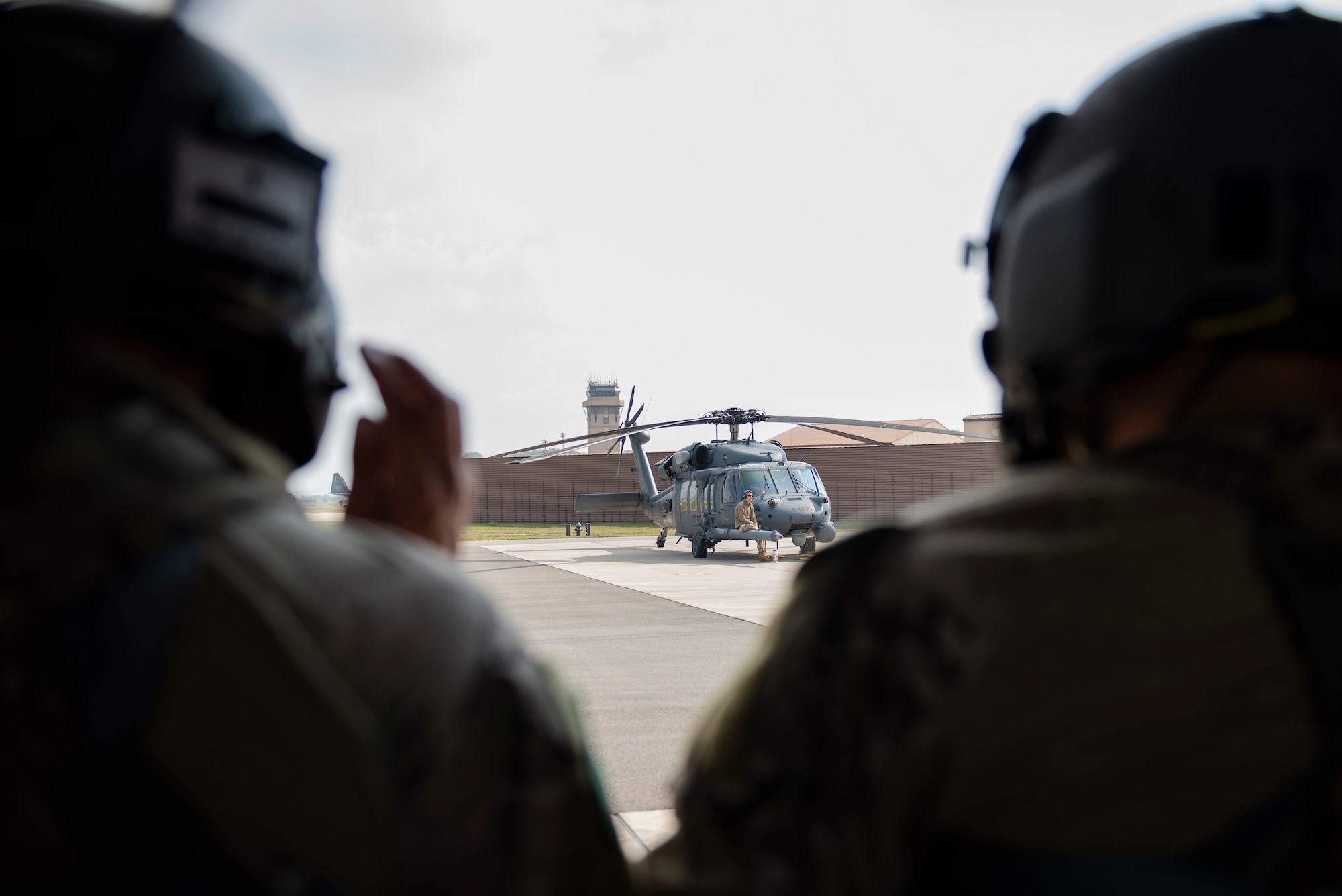 33rd Rescue Squadron Airmen prepare for flight in a HH-60G Pave Hawk helicopter during a combat search and rescue training event