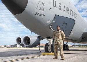 U.S. Air Force MSgt. Michael Fulton, 50th Air Refueling Squadron superintendent, pauses for a photo in front of a KC-135 Stratotanker aircraft on the flight line Oct. 6, 2021, at MacDill Air Force Base, Florida.