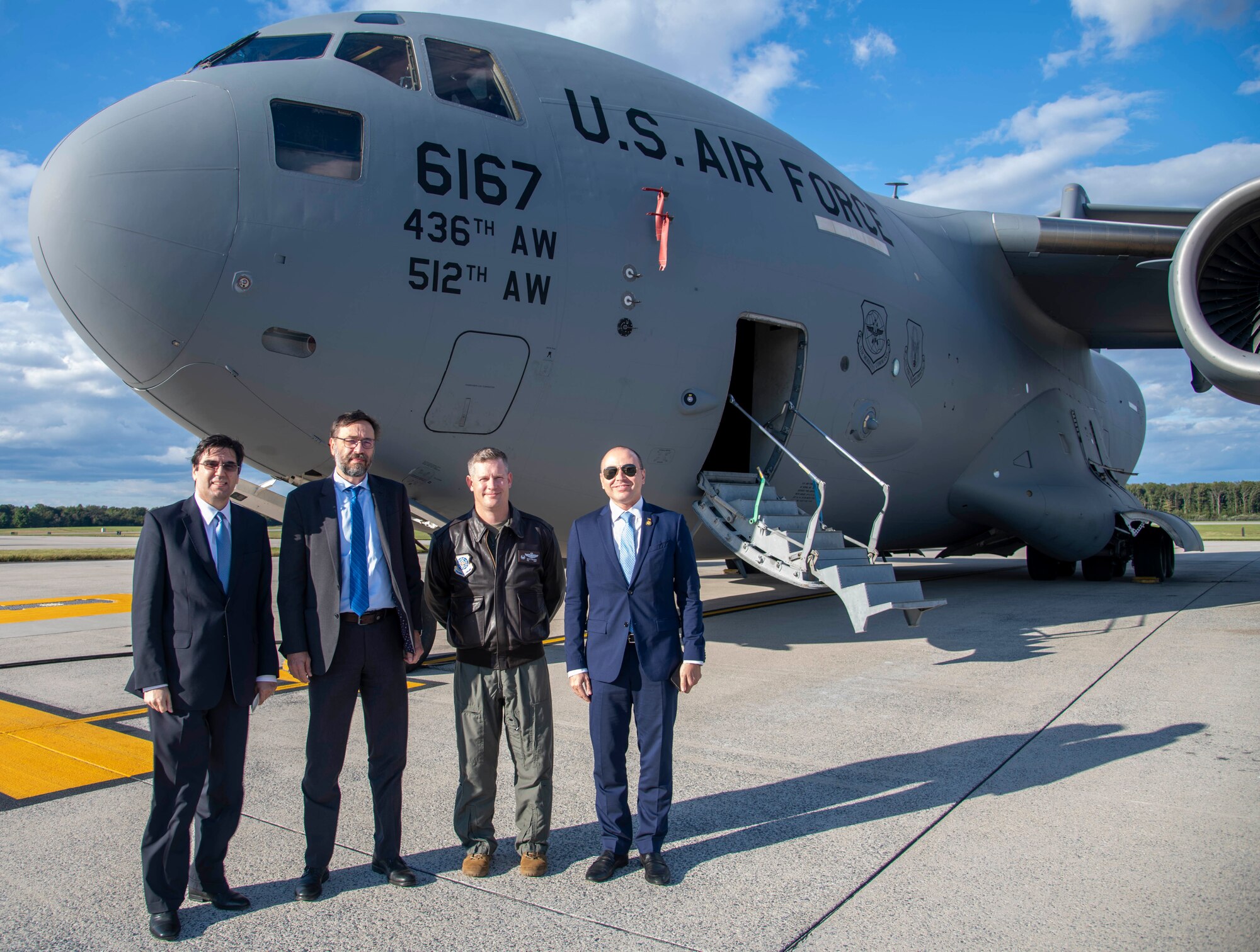 Bulgarian Ambassador to the United States, Tihomir Stoytchev, left, Slovakian Ambassador to the U.S. Radovan Javorčík, middle-left, Col. Scott Raleigh, middle-right, 436th Operations Group commander, and Romanian Ambassador to the U.S., Andrei Muraru, stand in front of a C-17 Globemaster III during a visit to Dover Air Force Base, Delaware, Oct. 18, 2021. During the visit, the ambassadors learned about the history and current missions of Dover AFB. (U.S. Air Force photo by Tech. Sgt. Nicole Leidholm)