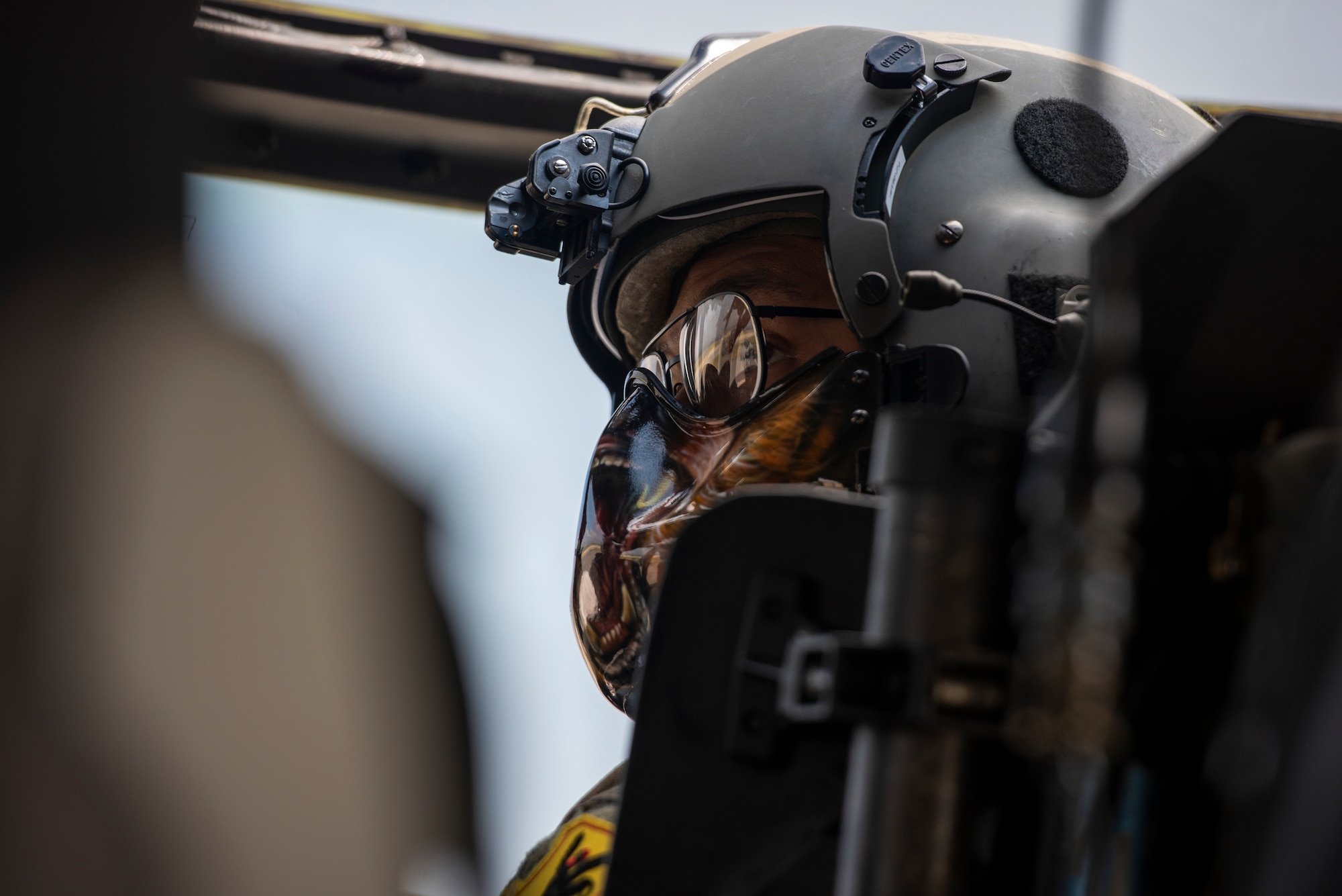 Capt. Marcus “Bear” Walker, 33rd Rescue Squadron helicopter pilot, checks on his crew during a combat search and rescue training event