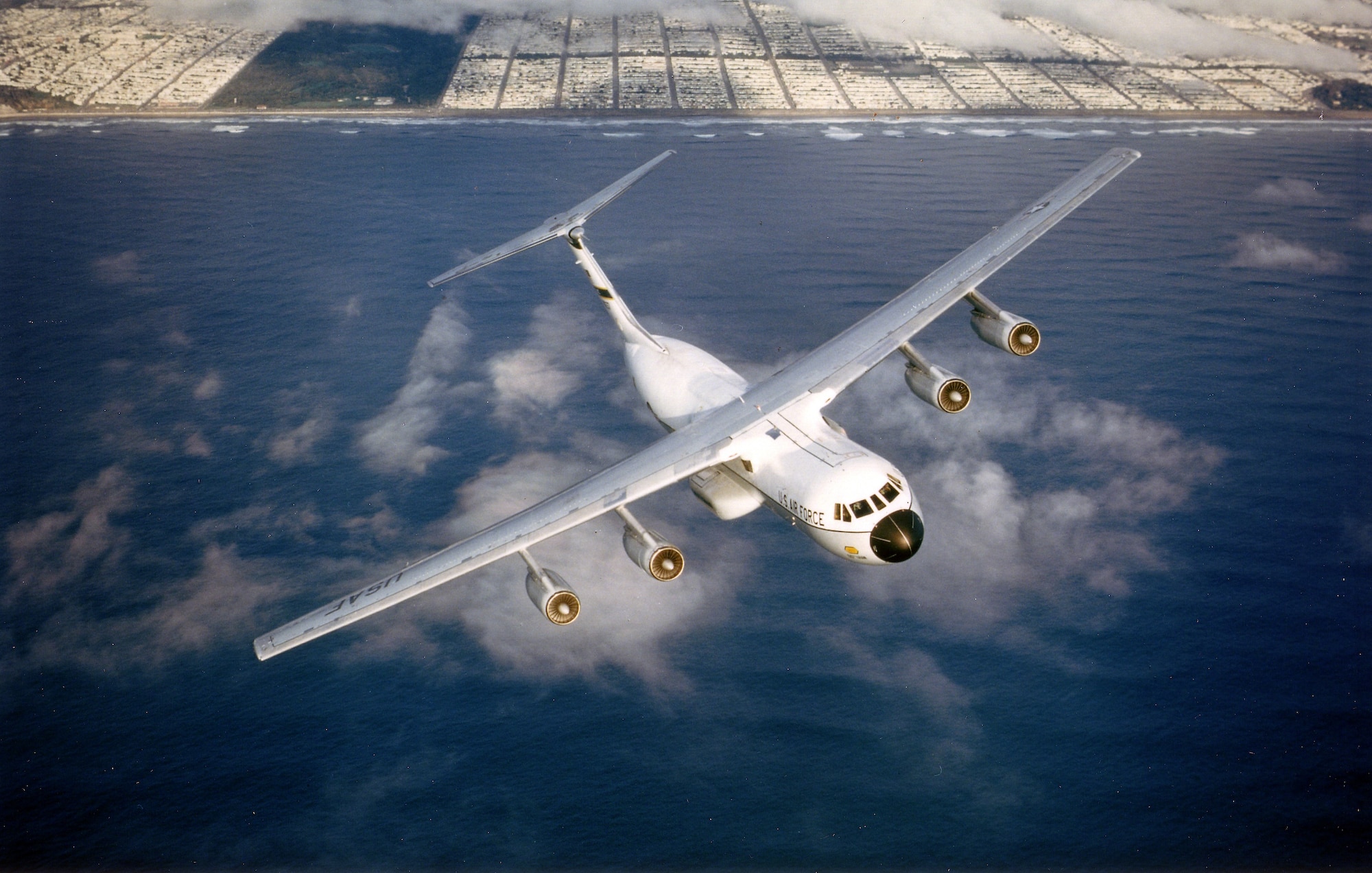 A C-141 in flight over San Francisco Bay.