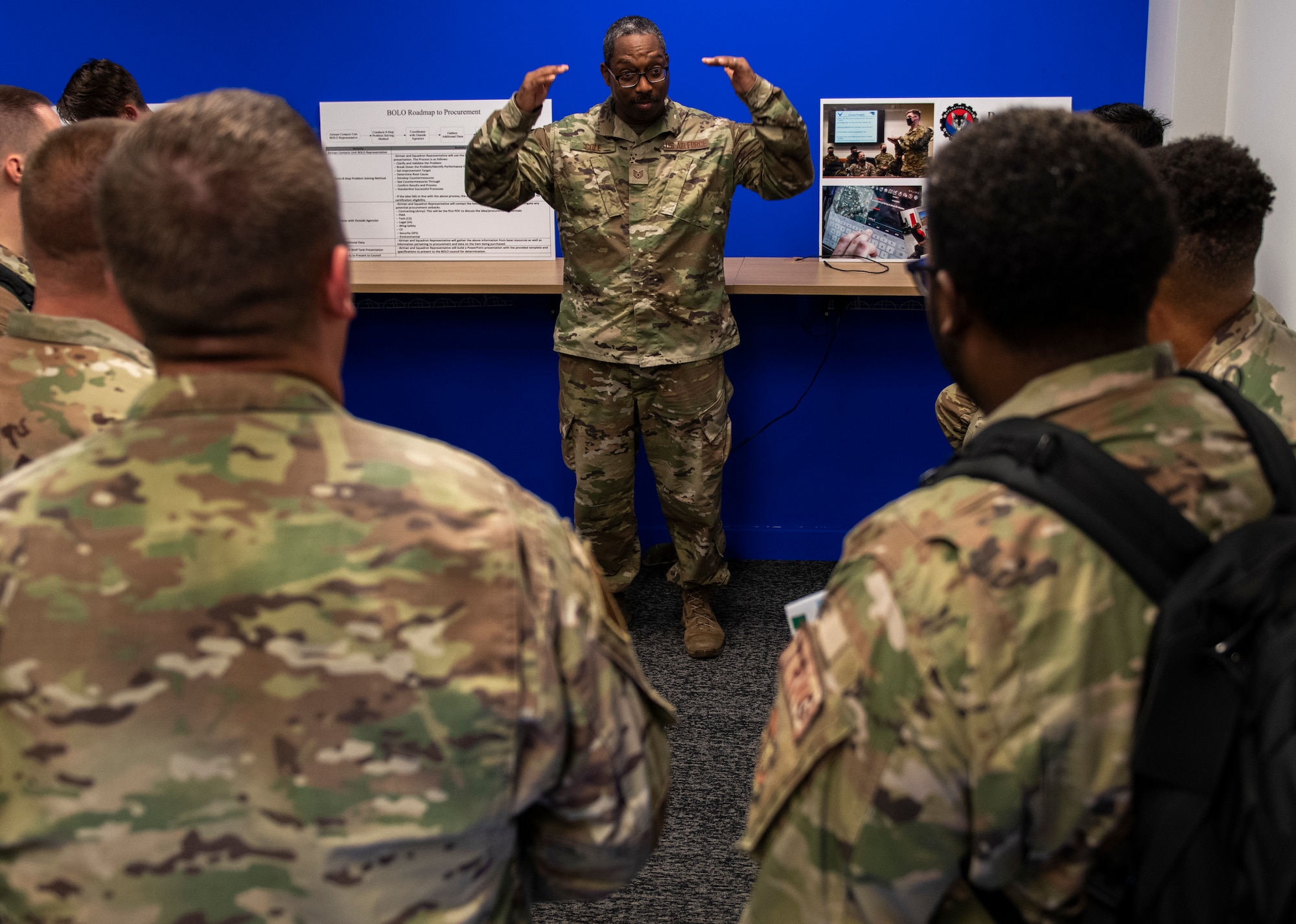 Tech. Sgt. Byron Cole, 8th Maintenance Squadron inspections section chief, talks about his experience pitching an innovative idea during an Operation Be On the Lookout for Opportunity (BOLO) Open House at Kunsan Air Base, Republic of Korea, Oct. 13, 2021. Cole pitched an inner ear bone conducting headset during a “Wolf Tank” held in April, which ultimately received Air Force funding, and is now being implemented. (U.S. Air Force photo by Senior Airman Suzie Plotnikov)