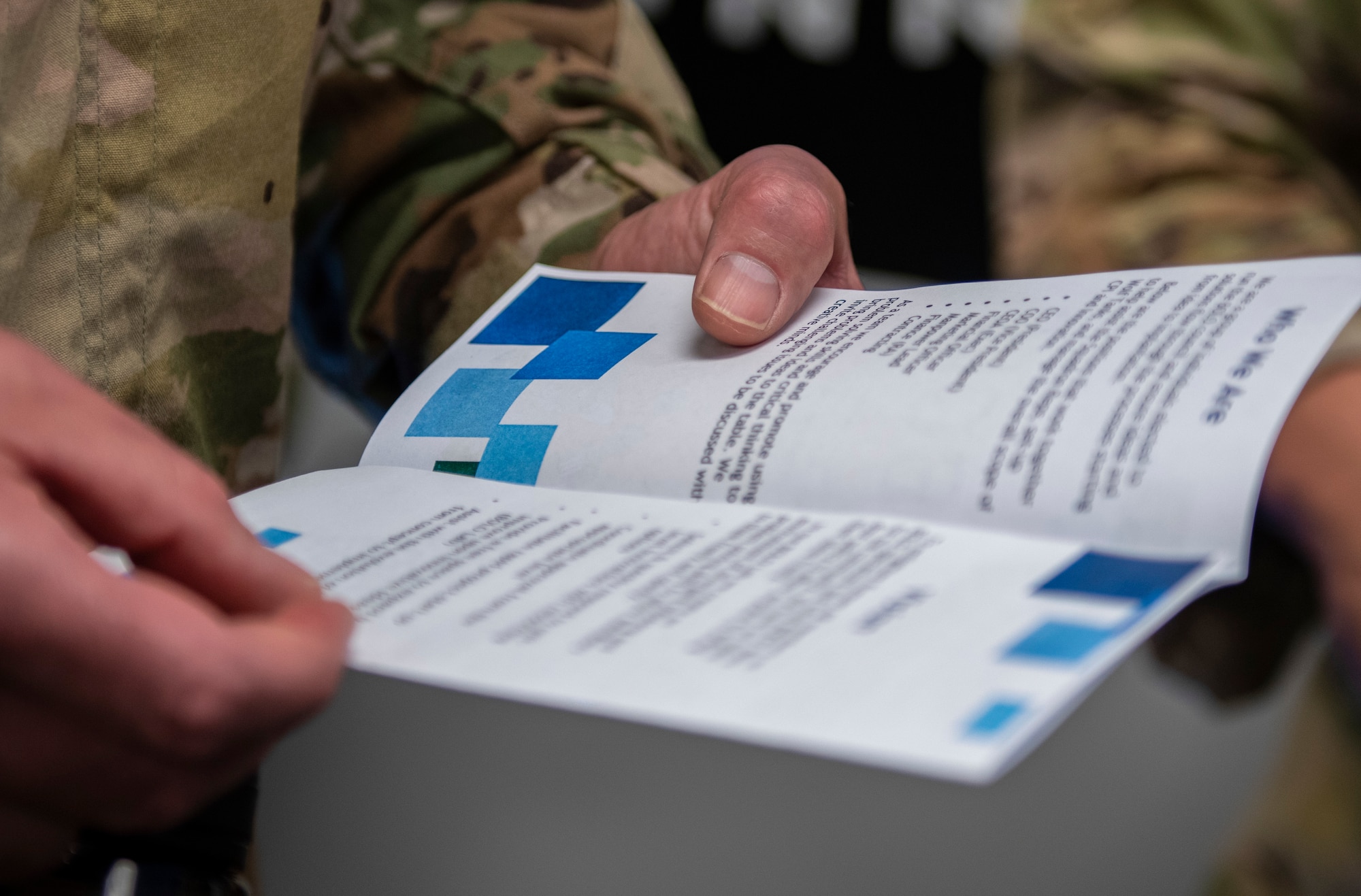 Master Sgt. Geoff Bendien, 8th Civil Engineer Squadron health and safety assistant chief, reads a flyer during an Operation Be On the Lookout for Opportunity (BOLO) Open House at Kunsan Air Base, Republic of Korea, Oct. 13, 2021. The open house was held to raise awareness about Operation BOLO, find new innovative ideas and talk about the future of the program. (U.S. Air Force photo by Senior Airman Suzie Plotnikov)