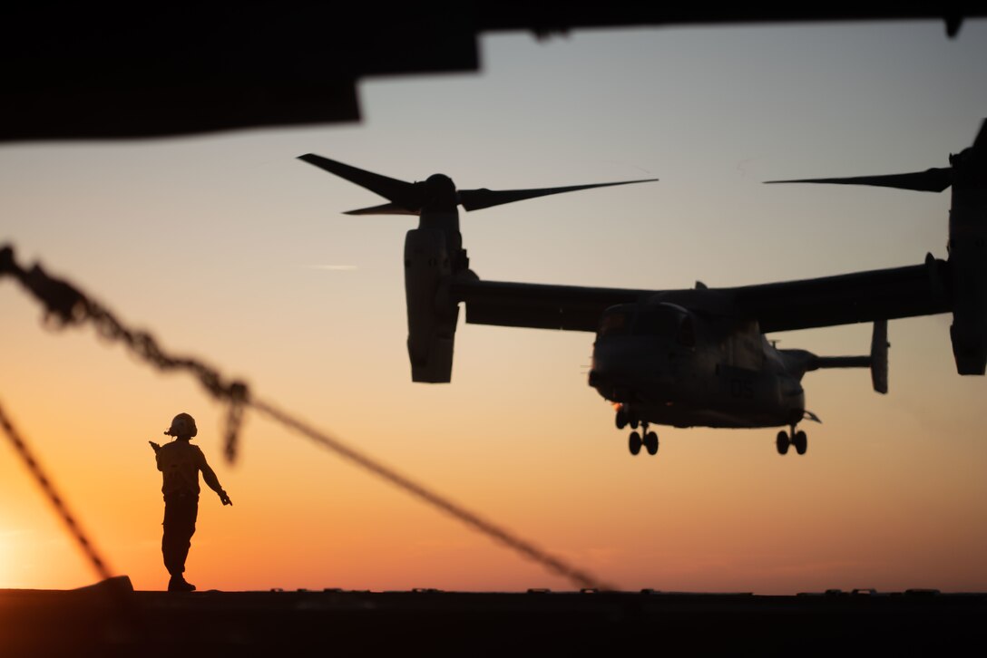 An MV-22 Osprey assigned to the Aviation Combat Element, 22nd Marine Expeditionary Unit prepares to land aboard amphibious assault ship USS Kearsarge (LHD 3), Oct. 20. The 22nd MEU and Amphibious Squadron (PHIBRON) Six is underway for PHIBRON-MEU Integrated Training (PMINT) in preparation for an upcoming deployment. PMINT is the first at-sea period in the MEU's Predeployment Training Program; it aims to increase interoperability and build relationships between Marines and Sailors. (U.S. Marine Corps photo by Staff. Brittney Vella)