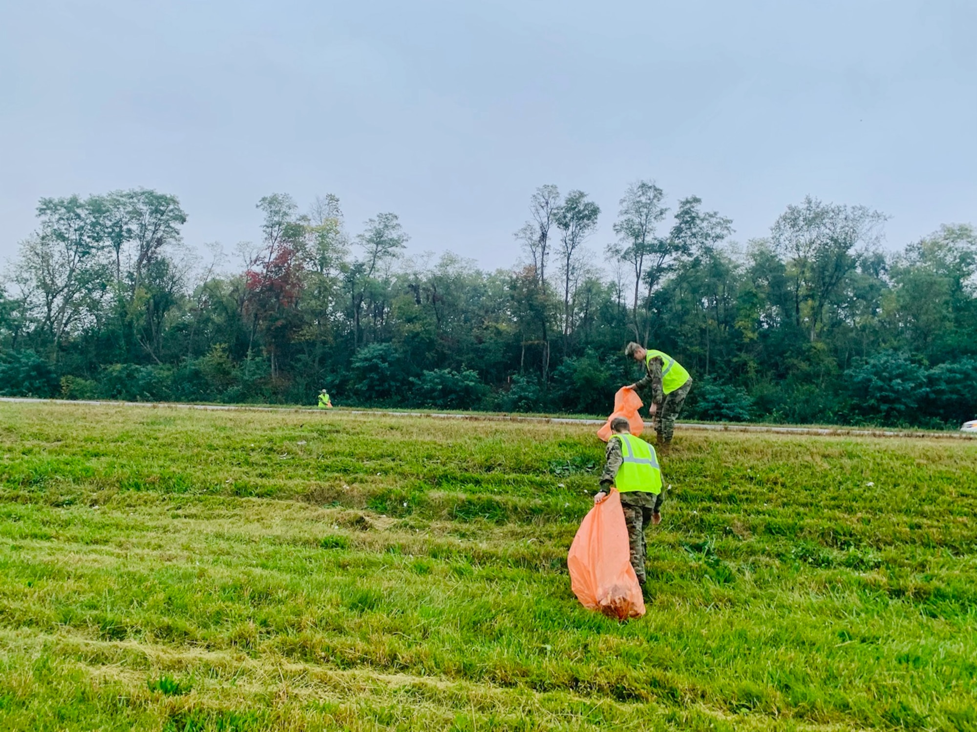 Volunteers from the National Air and Space Intelligence Center on Wright-Patterson Air Force Base pick up trash Oct. 7 on state Route 444 as part of an Adopt-A-Highway community-cleanup program with the Ohio Department of Transportation. (Contributed photo)