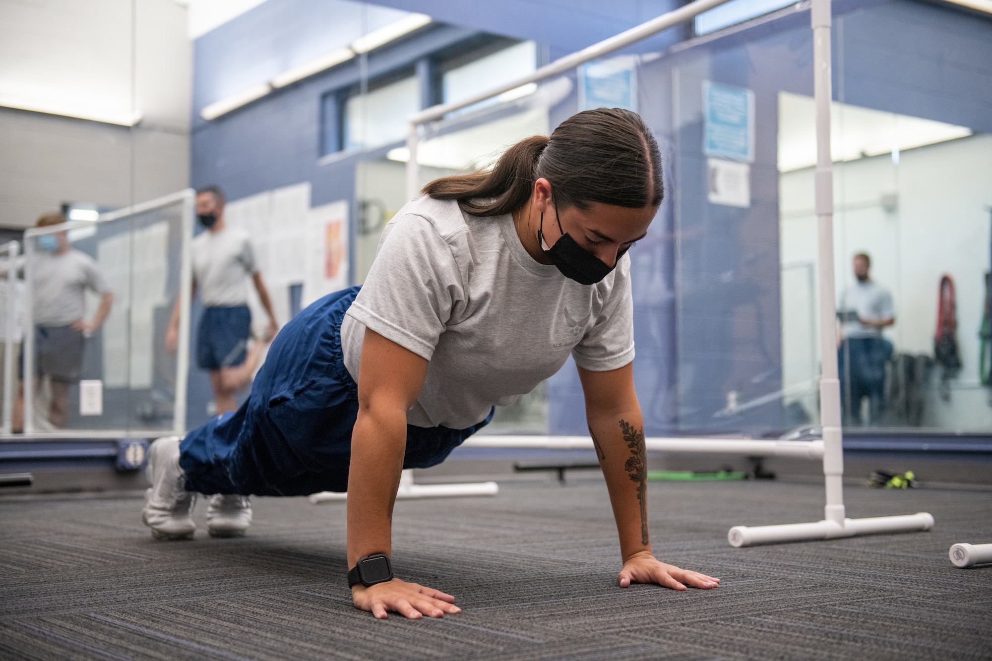 U.S. Air Force Senior Airman Hannah Pettersson, 419th Aircraft Maintenance Squadron, demonstrates a proper pushup during a PT test at Hill Air Force Base, Utah on Oct. 3, 2021.