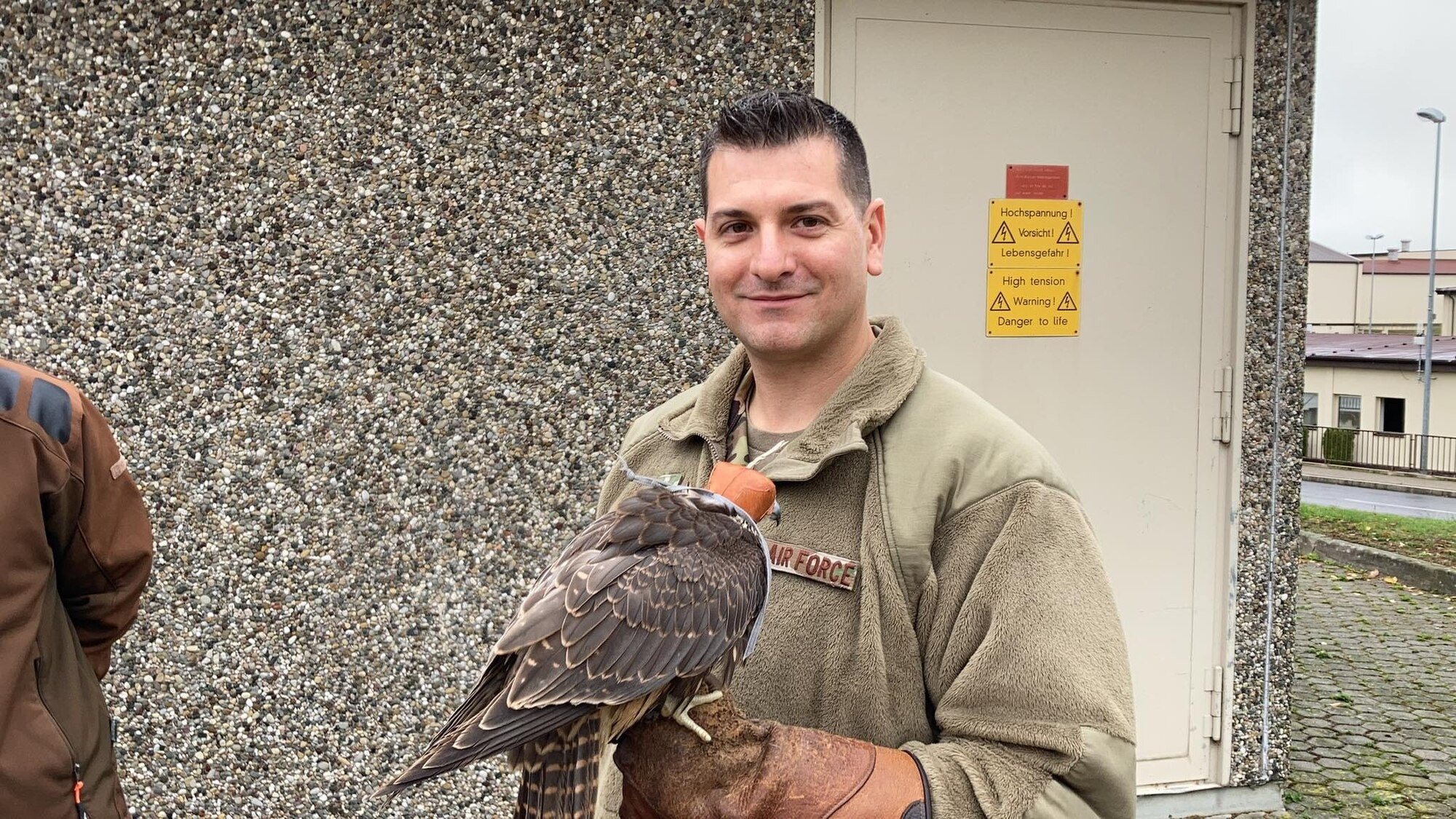 airmen holds falcon