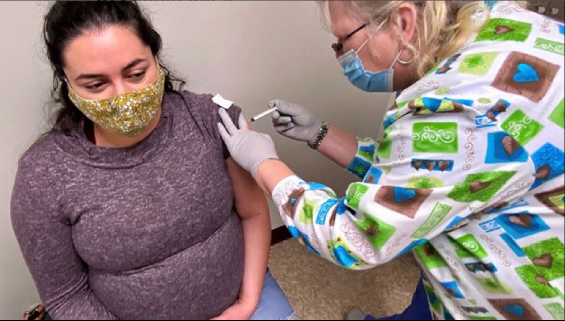 Sandra Murray-Campbell, licensed practical nurse, administers a COVID-19 vaccine to Army Capt. Bryana Fournier , a registered nurse for the Bayne-Jones Army Community Hospital emergency department at the Joint Readiness Training Center and Fort Polk, Louisiana. DOD and CDC advise all pregnant people, those trying to get pregnant, or breastfeeding to get vaccinated against COVID-19 (Photo by: Jean Graves, Regional Health Command Central).