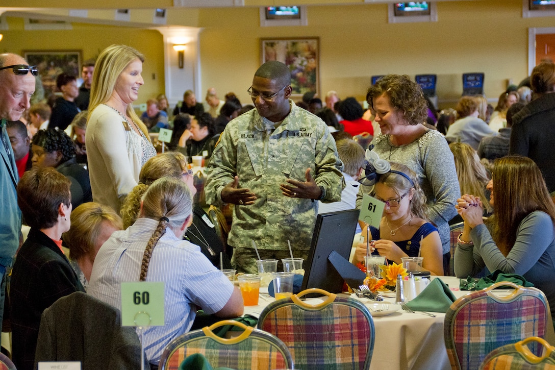 Brig. Gen. Wayne L. Black, assistant adjutant general-Army for the Indiana National Guard, speaks to family members of a fallen U.S. service member during a Survivors Outreach Services event in Louisville, Ky., Nov. 2, 2014. Families from 10 states gathered at Churchill Downs race track for the fifth annual Survivors Day at the Races.