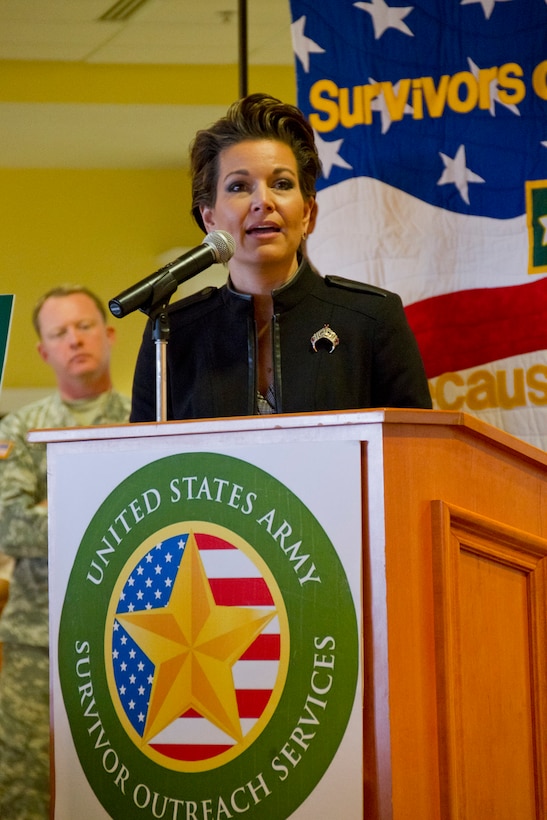 Heather French Henry, Commissioner of the Kentucky Department of Veterans Affairs speaks to family members of fallen U.S. service members during a Survivors Outreach Services event in Louisville, Ky., Nov. 2, 2014. Families from 10 states gathered at Churchill Downs race track for the fifth annual Survivors Day at the Races.