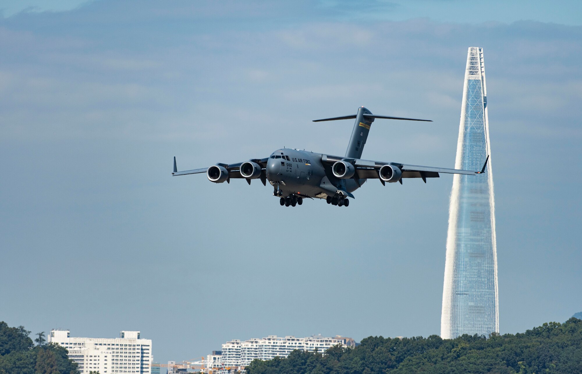 A U.S. Air Force C-17 Globemaster III, assigned to the 535th Airlift Squadron based at Joint Base Pearl-Harbor Hickam, Hawaii, prepares for landing at Seoul Air Base, Republic of Korea, as part of the Seoul International Aerospace and Defense Exhibition 2021, Oct. 18. Seoul ADEX 21 offers a venue to deepen our relationship with the Republic of Korea and enhance regional security through expanded military-to-military cooperation and with regional partners and allies. (U.S. Air Force photo by Staff Sgt. Gabrielle Spalding)