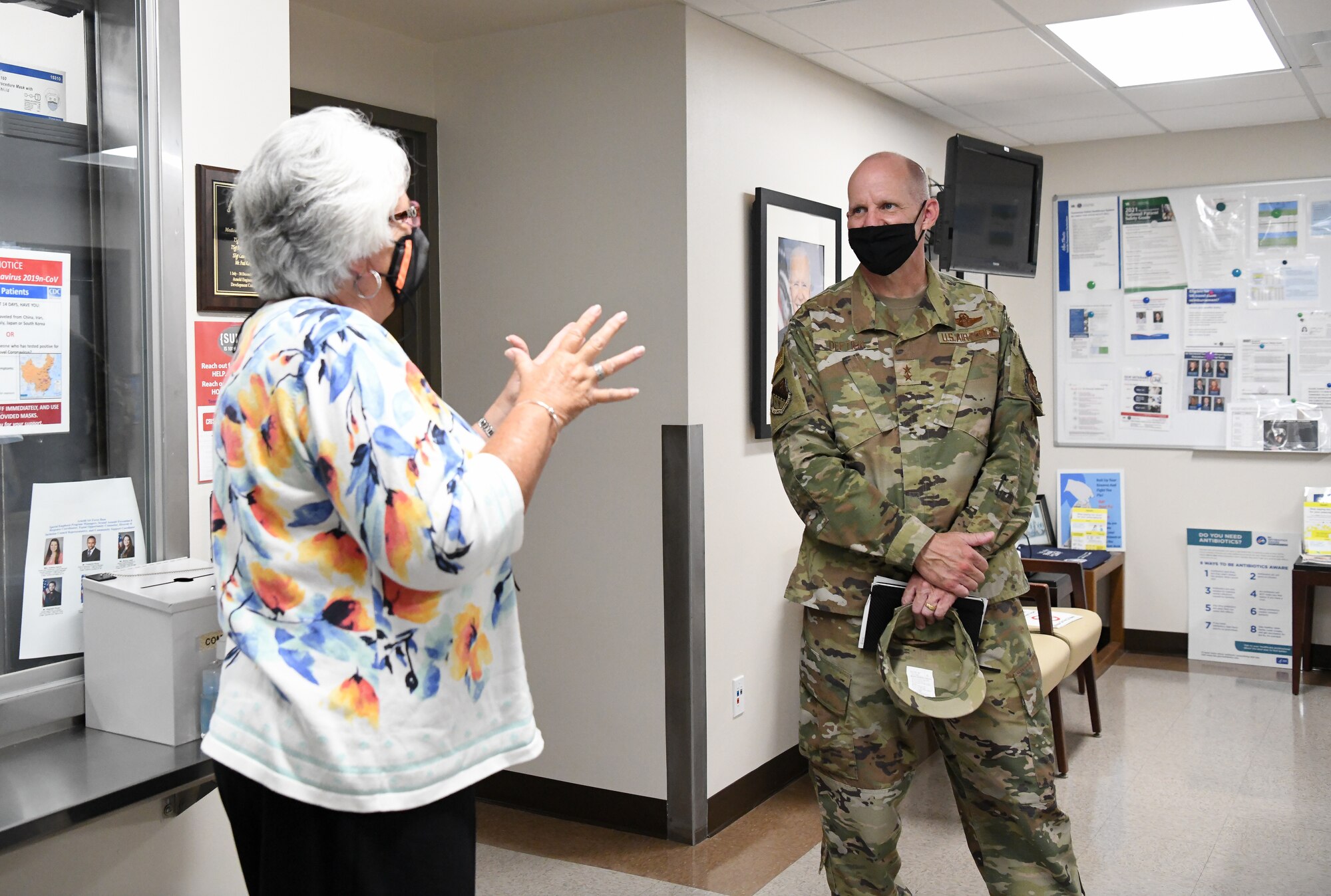 Judy Mohler, a health system specialist, speaks with Maj. Gen. Evan Dertien, commander, Air Force Test Center, during his visit to Arnold Air Force Base, oct. 14, 2021. (U.S. Air Force photo by Jill Pickett)