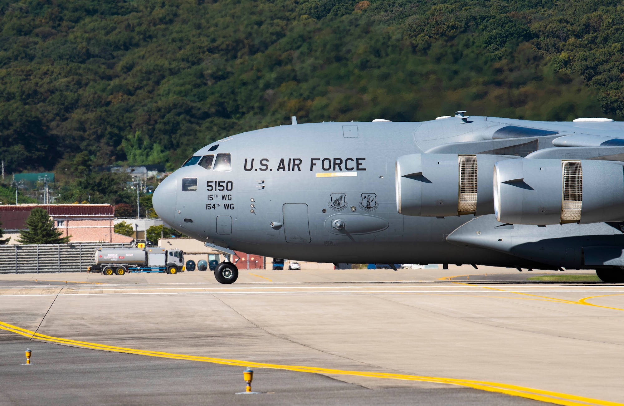 A C-17 Globemaster III, assigned to Joint Base Pearl-Harbor Hickam, Hawaii, taxis on the flightline following an aerial demonstration as part of the Seoul International Aerospace and Defense Exhibition 2021, at Seoul Air Base, Republic of Korea, Oct. 17, 2021. Seoul ADEX 21 is the largest, most comprehensive event of its kind in Northeast Asia, attracting aviation and industry professionals, key defense personnel, aviation enthusiasts and the general public alike. (U.S. Air Force photo by Staff Sgt. Gabrielle Spalding)