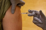 A Kentucky Army National Guard Soldier receives a COVID-19 vaccination at the Bluegrass Army Depot in Richmond, Kentucky Oct. 16, 2021. Soldiers and Airmen received the vaccine as part of Operation Fortified Guardian for the Kentucky National Guard.