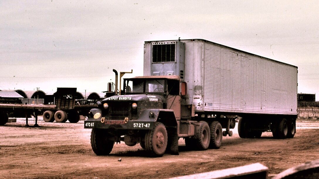 A refrigerated container is pulled by a tractor from the 572nd Transportation Company in 1970.