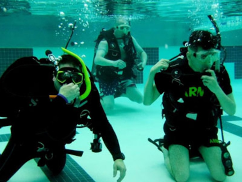 Courtesy Photo | Juan Carrasco (left), Master Sgt. Neil Ashley (center), and Spc. Joseph Suarez (right) posed for a photo during an Intro to Scuba class offered by the Fort Drum Soldier Recovery Unit, New York, at the Magrath Gym on July 15.