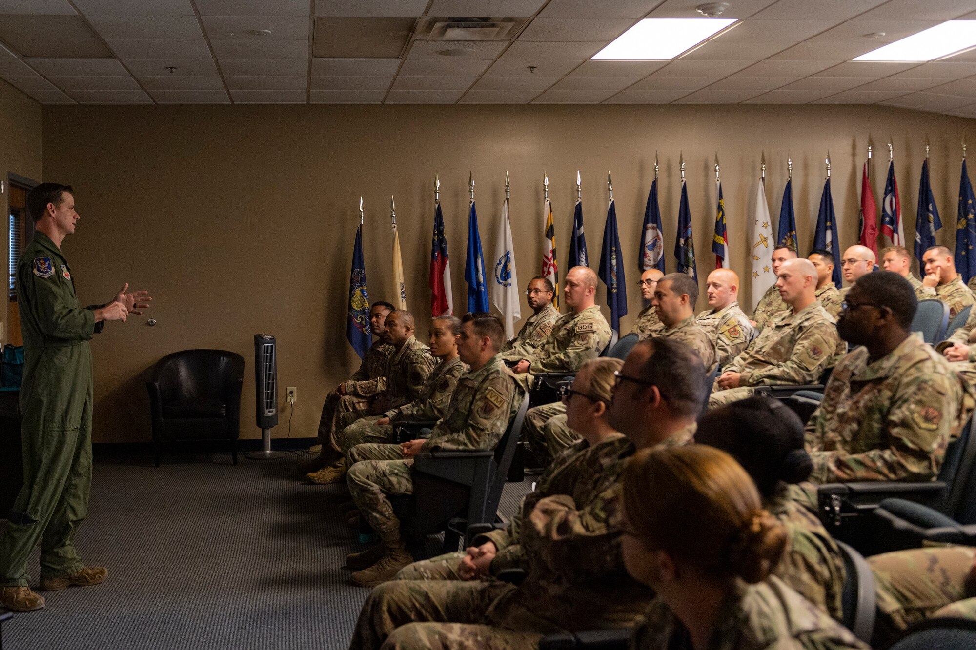 Photo of an Airman addressing the audience
