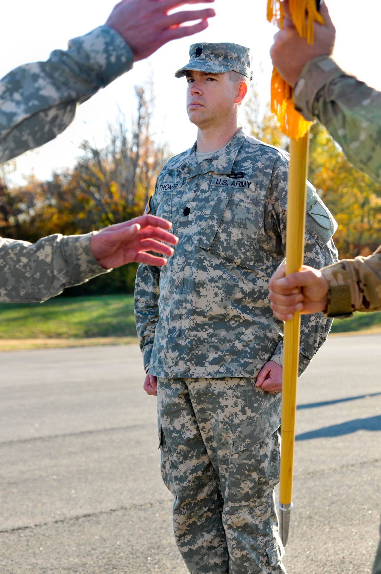 Kentucky Army National Guard Lt. Col. Scott C. Thomas waits for the 751st Troop Command guidon to be passed from former 751st battalion commander, Lt. Col. Brent A. Wilkins, at Wendell H. Ford Regional Training Center in Greenville, Ky., Oct. 27, 2012. Lt. Col. Thomas assumed command of the battalion. (U.S. Army Photo by Sgt. Cody Stagner, 133rd Mobile Public Affairs Detachment/Released)