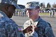 Kentucky Army National Guard Lt. Col. Brent A. Wilkins receives the Meritorious Service Medal from Col. John Edwards, commander of the 75th Troop Command, at Wendell H. Ford Regional Training Center in Greenville, Ky., Oct. 27, 2012. Lt. Col. Wilkins was presented this award during a change of command ceremony in which he released his command to Lt. Col. Scott C. Thomas. (U.S. Army Photo by Sgt. Cody Stagner, 133rd Mobile Public Affairs Detachment/Released)