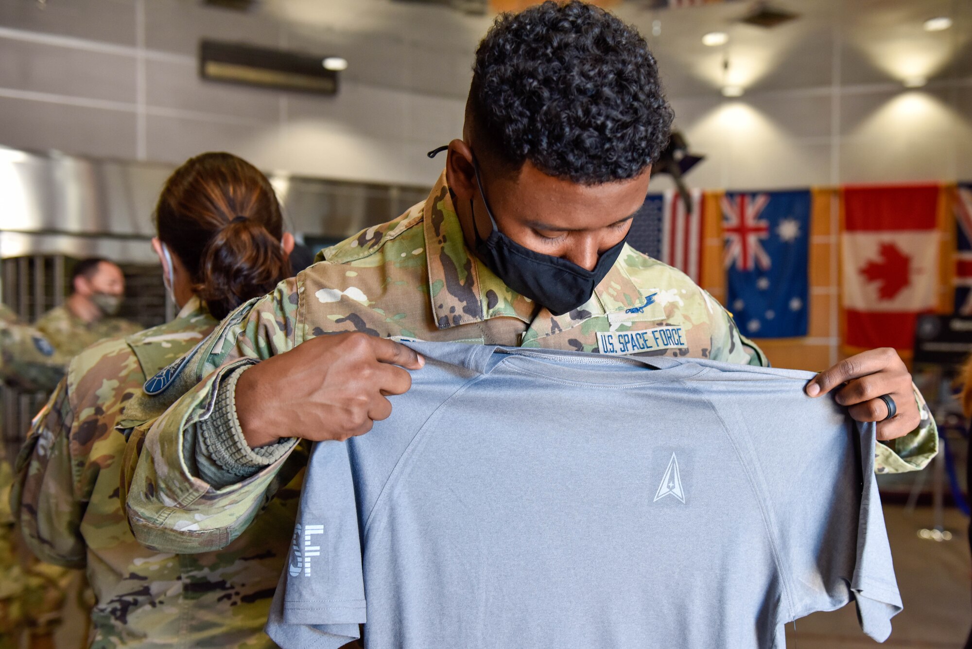 A U.S. Space Force Guardian examines the prototype for the new USSF physical training uniform on Buckley Space Force Base, Colo., Oct 20, 2021. The physical training uniform is being designed with the focus of maintaining breathability, durability, and comfort. (U.S. Space Force photo by Airman 1st Class Wyatt Stabler)