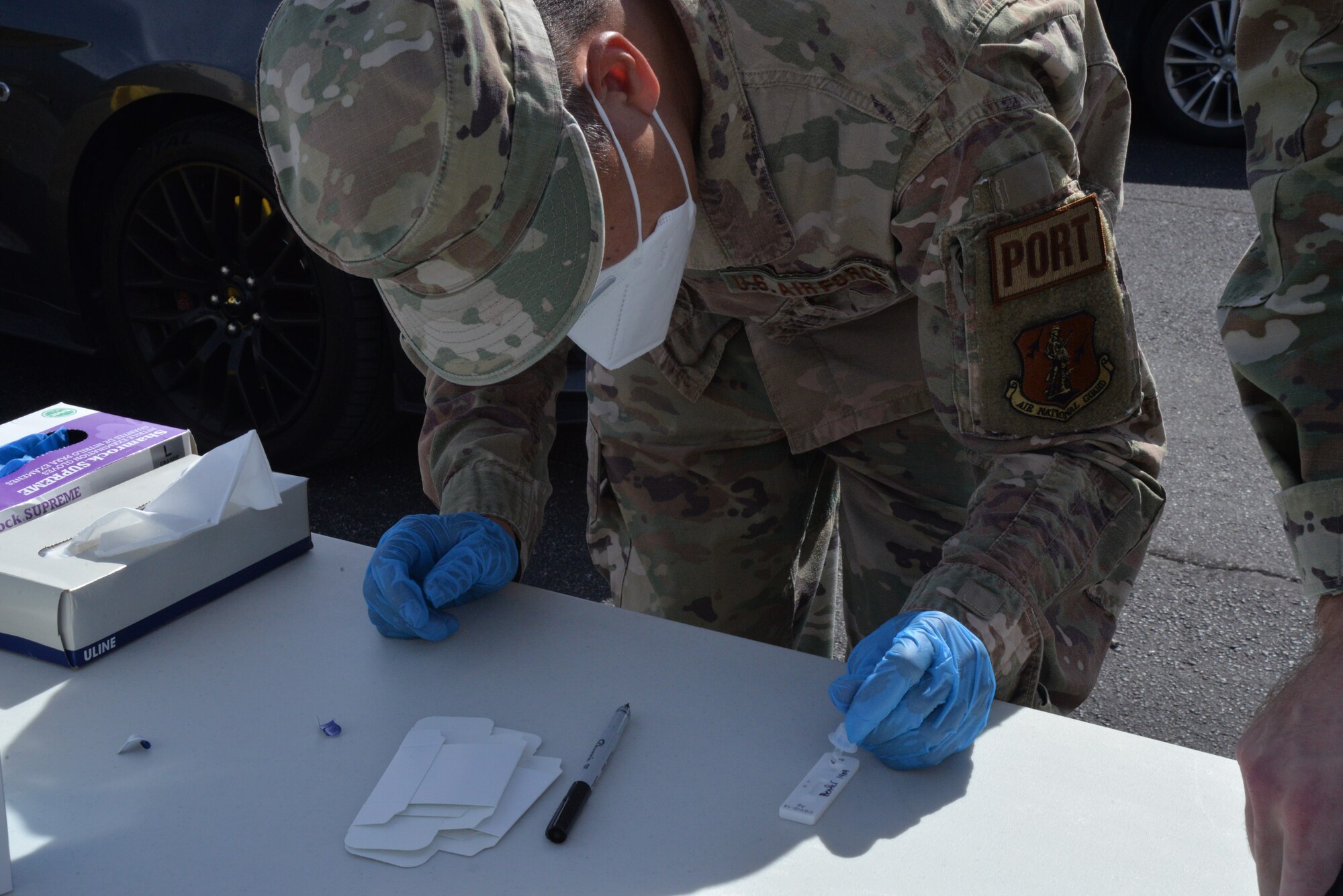 Airman preps a COVID testing strip.