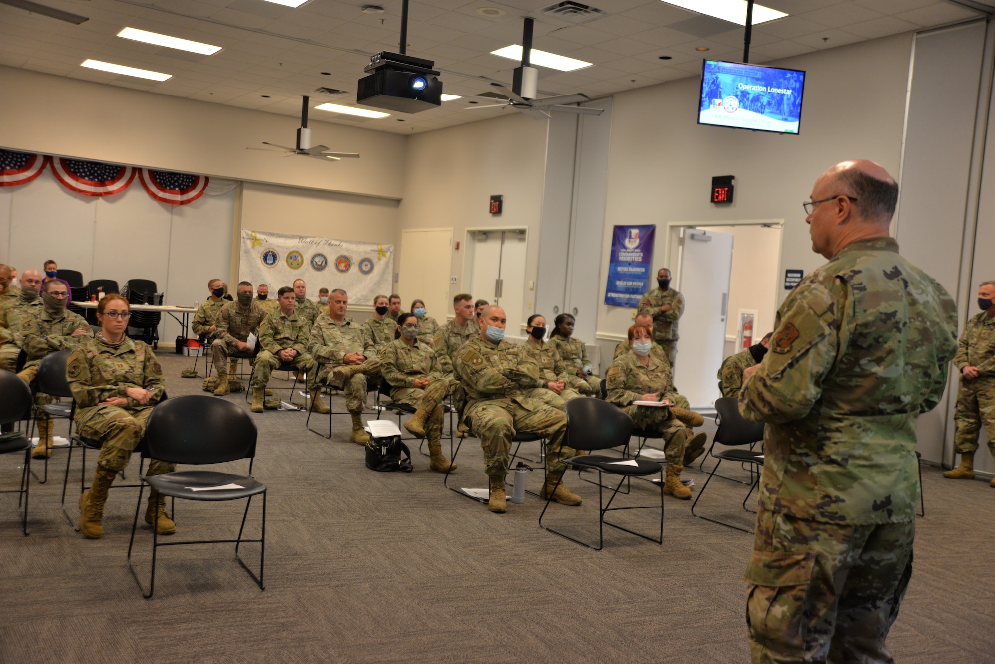 Wing commander talks to Airmen.