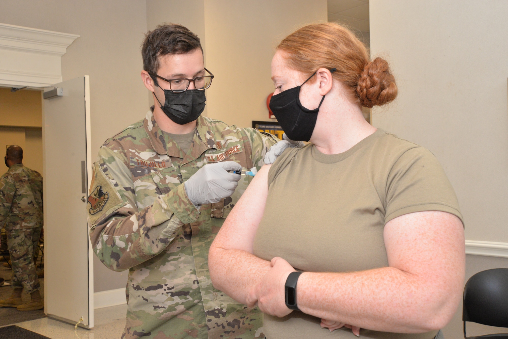 Airman receives flu shot from medical.