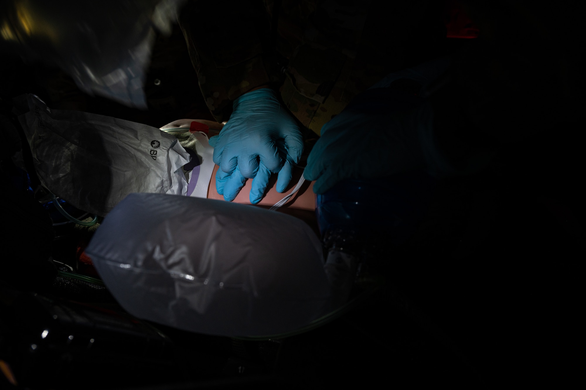Airman performs CPR on a simulated patient.