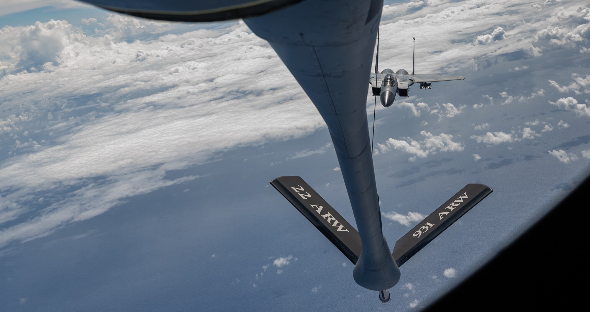 An F-15C Eagle approaches a KC-135 for in-flight refueling.