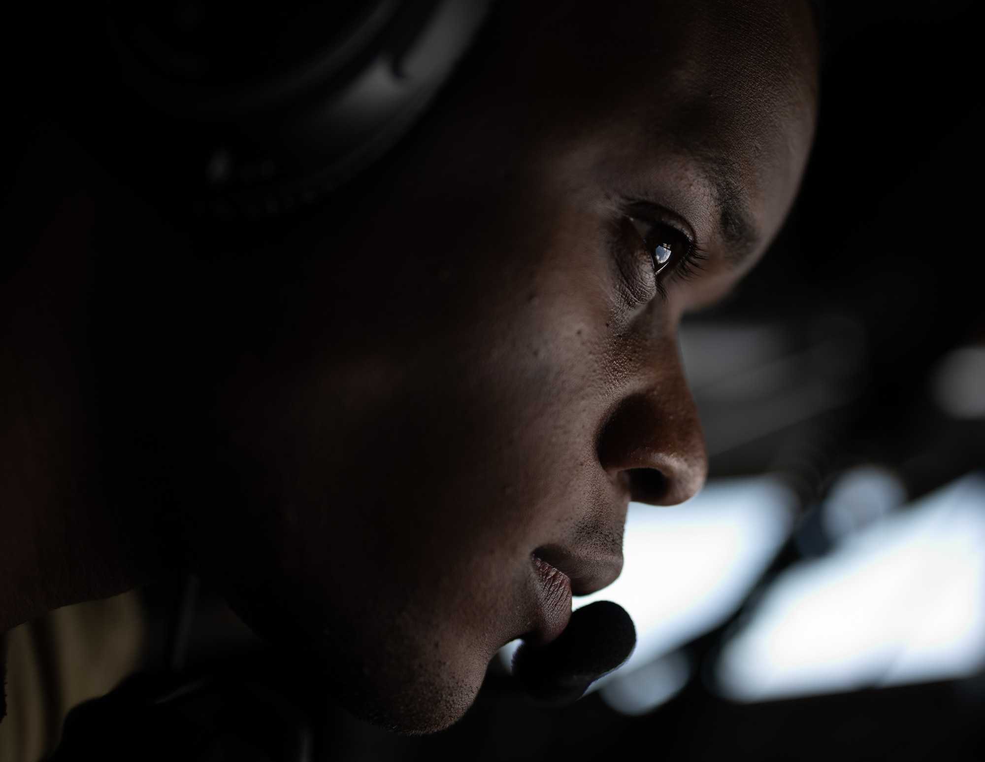 An Airman looks for aircraft in the sky.