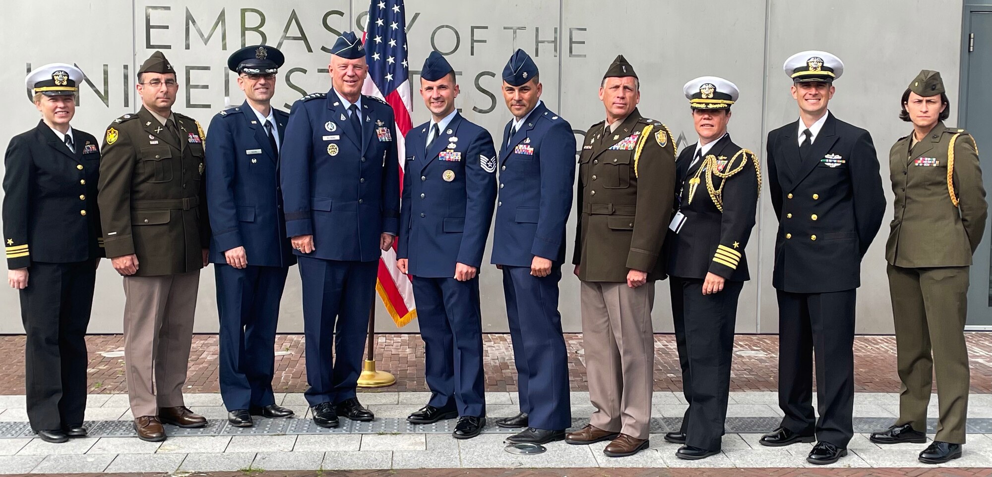Chief of Space Operations Gen. John W. "Jay" Raymond (center left) poses for a photo with U.S. service members at the US Embassy in The Hague.