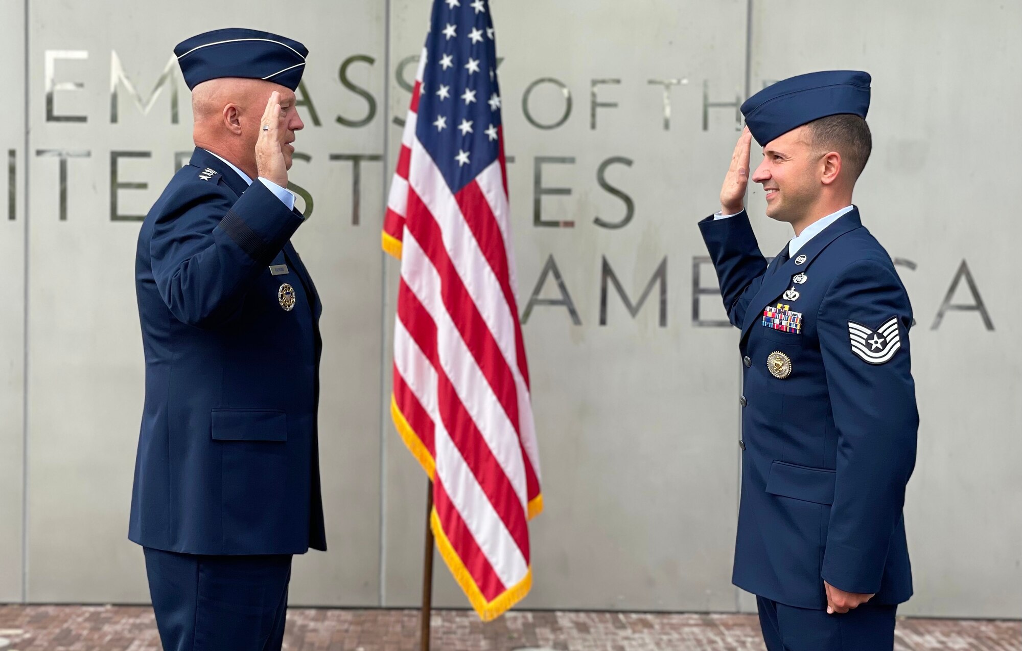 Chief of Space Operations Gen. John W. "Jay" Raymond presides over the re-enlistment ceremony of Air Force Tech. Sgt. Jason Muscarella.