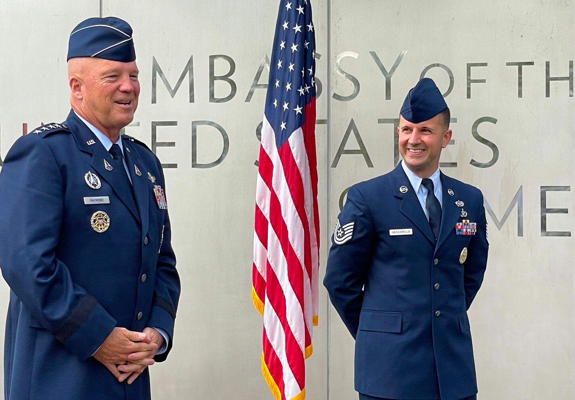 Chief of Space Operations Gen. John W. "Jay" Raymond presides over the re-enlistment ceremony of Air Force Tech. Sgt. Jason Muscarella