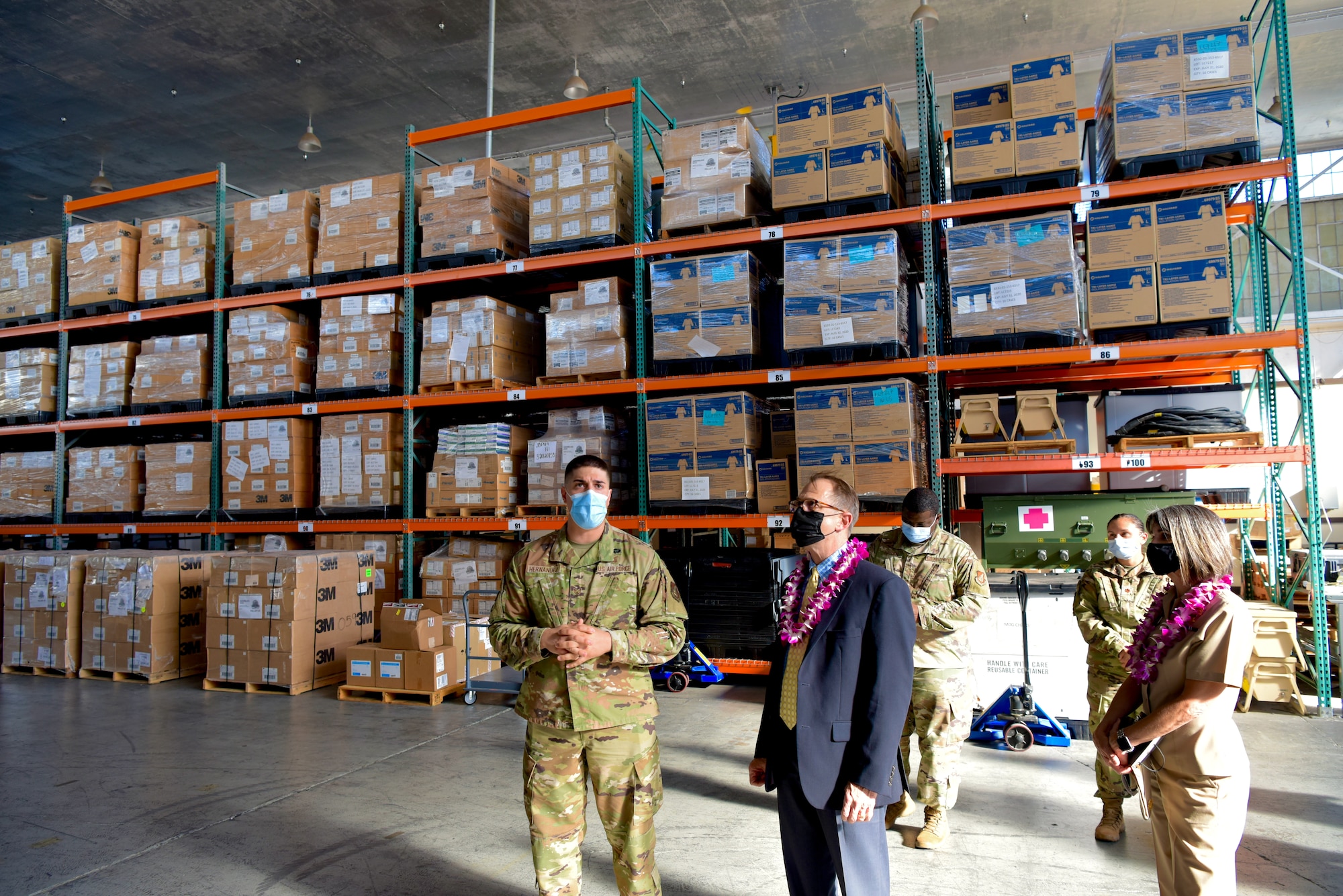 Staff Sgt. Mark Hernandez, 15th Medical Support Squadron NCOIC contract management, briefs Dr. Brian Lein, Defense Health Agency assistant director, about medical warehouse operations at Joint Base Pearl Harbor-Hickam, Hawaii, Oct. 19, 2021. The warehouse houses medical equipment utilized by the 15th Medical Group along with the Biomedical Equipment Technician shop, a unit that provides medical maintenance to the clinic. (U.S. Air Force photo by 1st Lt. Benjamin Aronson)