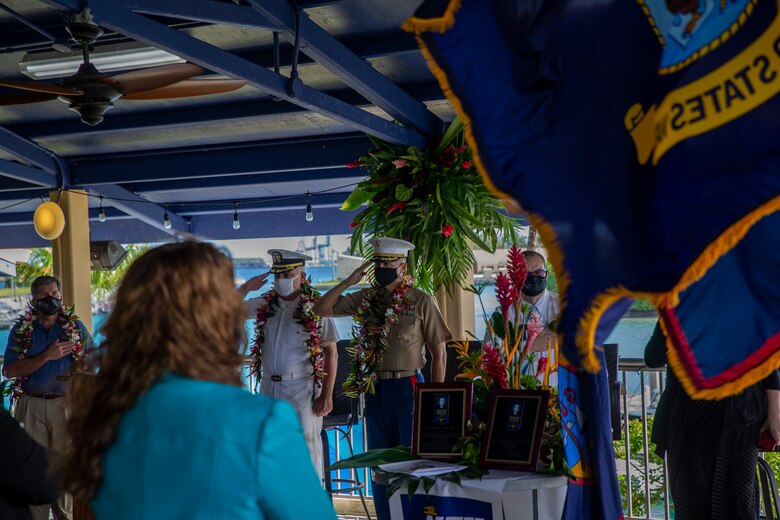 Senior military leaders render a salute during an award ceremony held on U.S. Naval Base Guam, Oct. 14, 2021.