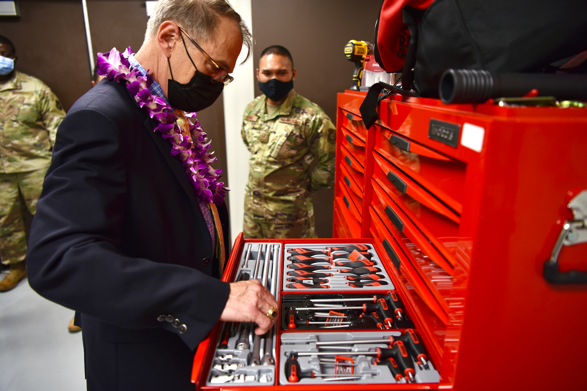 Dr. Brian Lein, Defense Health Agency assistant director, examines tools utilized by the Biomedical Equipment Technician shop at Joint Base Pearl Harbor-Hickam, Hawaii, Oct. 19, 2021. The BMET shop provides both in-clinic service, and a workshop to service equipment that is used by the 15th Medical Group. (U.S. Air Force photo by 1st Lt. Benjamin Aronson)