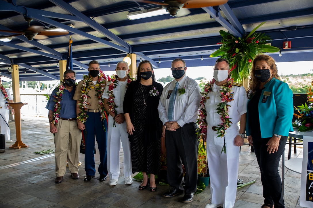 Navy Exchange Service Command (NEXCOM) representatives, Naval Exchange (NEX) Guam representatives, and senior military leaders pose for a group photo during an award ceremony held on U.S. Naval Base Guam, Oct. 14, 2021.