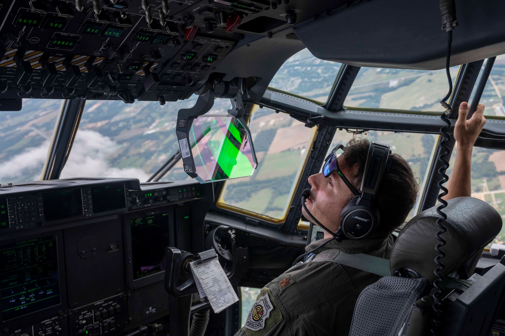 A pilot flies a C-130J