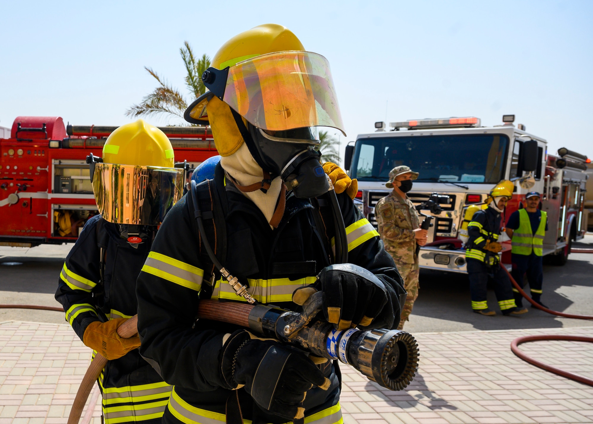 Royal Saudi Air Force firefighters participate in an emergency response bilateral exercise with the U.S. Air Force 378th Expeditionary Civil Engineer Squadron fire department, Prince Sultan Air Base, Kingdom of Saudi Arabia, Sept. 6, 2021. The exercise was integral to maintaining a working relationship between RSAF and USAF first responders and ensuring seamless integration in case of future emergencies at PSAB. (U.S Air Force photo by Senior Airman Samuel Earick)