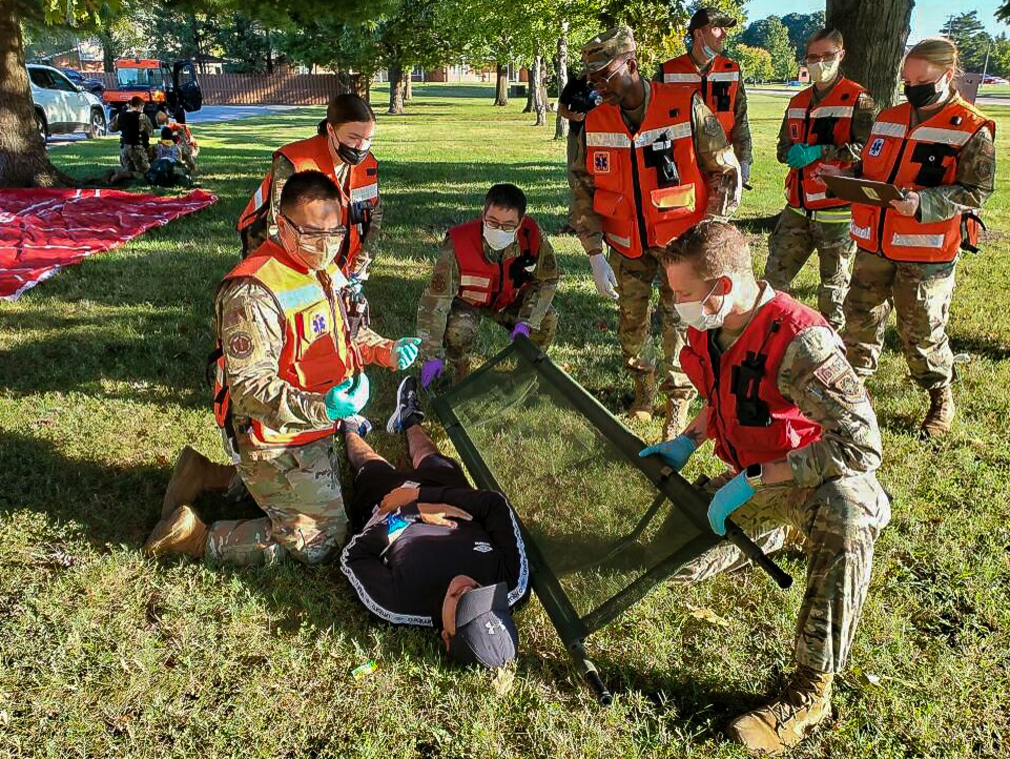 Medics prepare to lift patient on stretcher