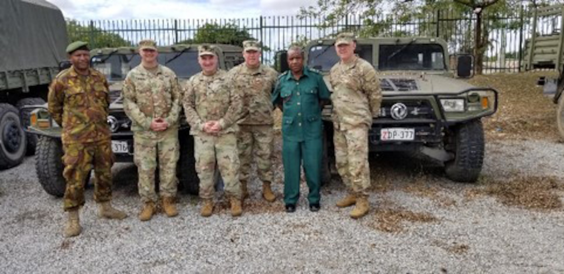 A Wisconsin Army National Guard delegation including, from left, Maj. Steve Harteau, Lt. Col. Derrek Schultheiss, Command Sgt. Maj. John Dietzler, and Col. Raymond Ripberger, visit a Papua New Guinea Defense Force support battalion in Papua New Guinea in July 2021. The Wisconsin National Guard began a new partnership with Papua New Guinea in 2020 as part of the State Partnership Program.