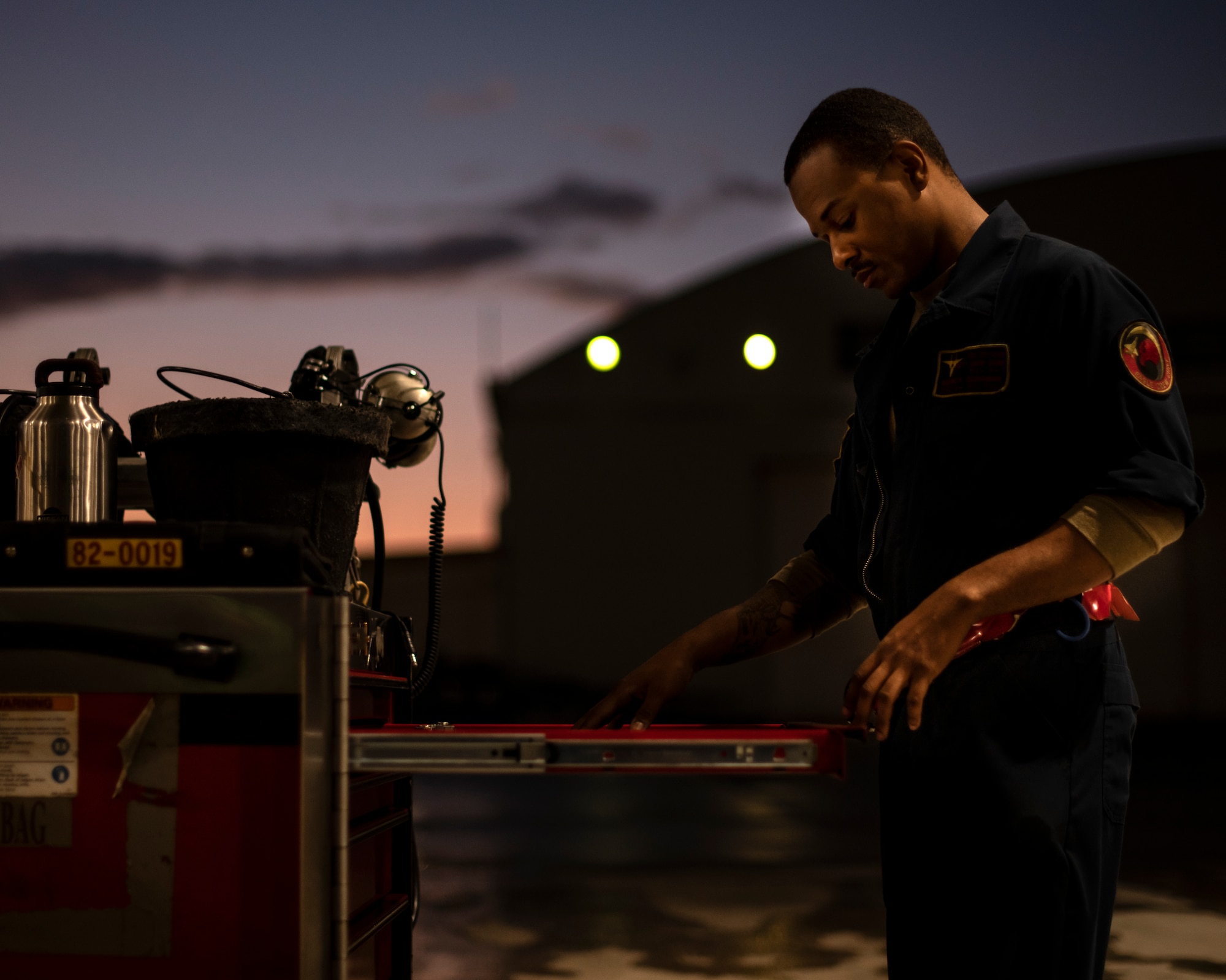 U.S. Air Force Staff Sgt. Quincy Clingman, 67th Aircraft Maintenance Unit crew chief, takes inventory of a toolbox prior to the start of a flight at Kadena Air Base, Japan, Oct. 19, 2021. Increased flying operations during the super surge exercise provide valuable experience for maintenance personnel, simulating the fast-paced environment they would face in a deployed location. (U.S. Air Force photo by Senior Airman Jessi Monte)