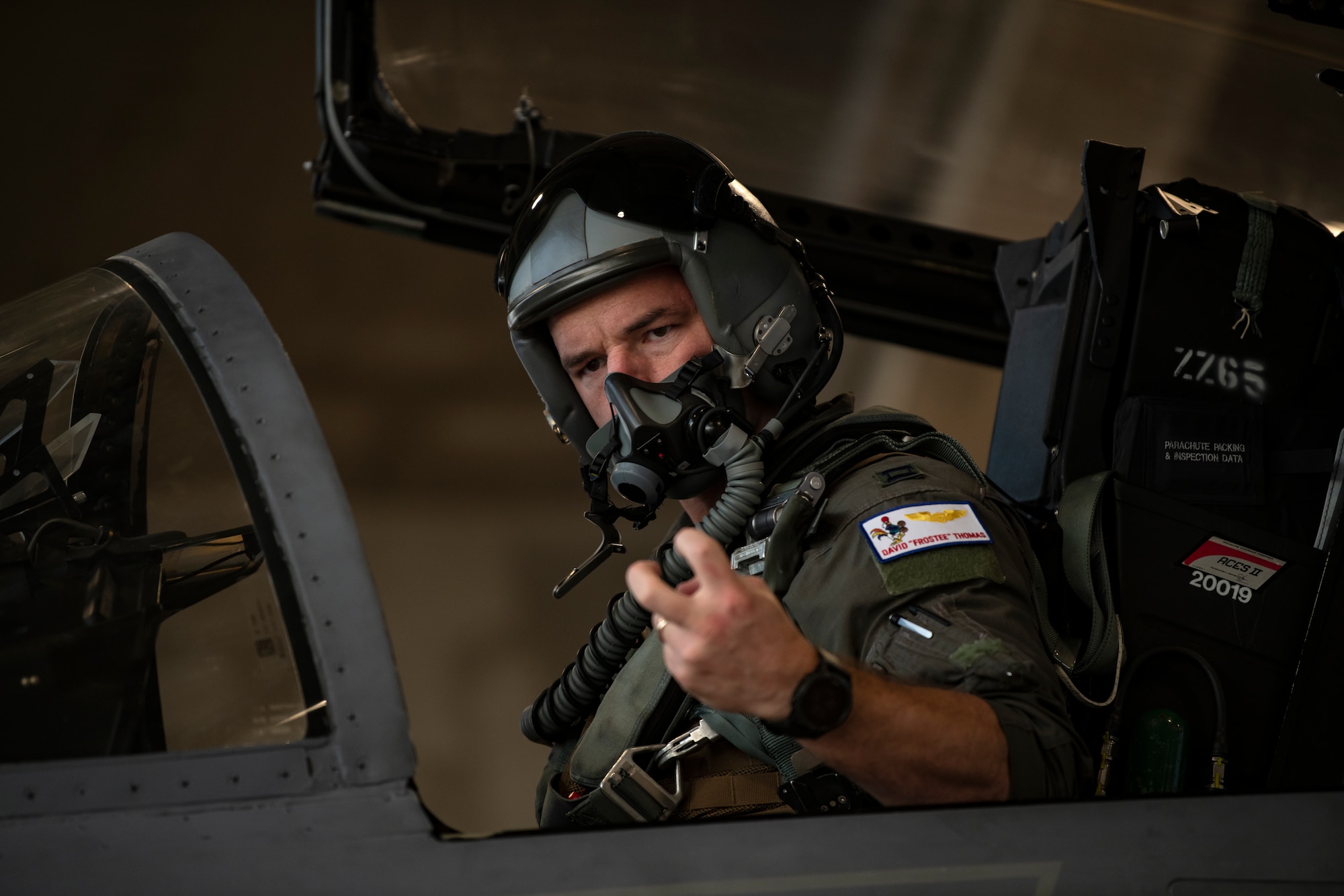 U.S. Air Force Capt. David Thomas, 67th Fighter Squadron F-15C Eagle pilot, gives the signal for starting the engine during a super surge exercise at Kadena Air Base, Japan, Oct. 19, 2021. 18th Wing fighter squadrons are capable of flying more than 100 sorties a day while conducting surge operations, honing air-to-air tactics and advanced combat maneuvers. (U.S. Air Force photo by Senior Airman Jessi Monte)