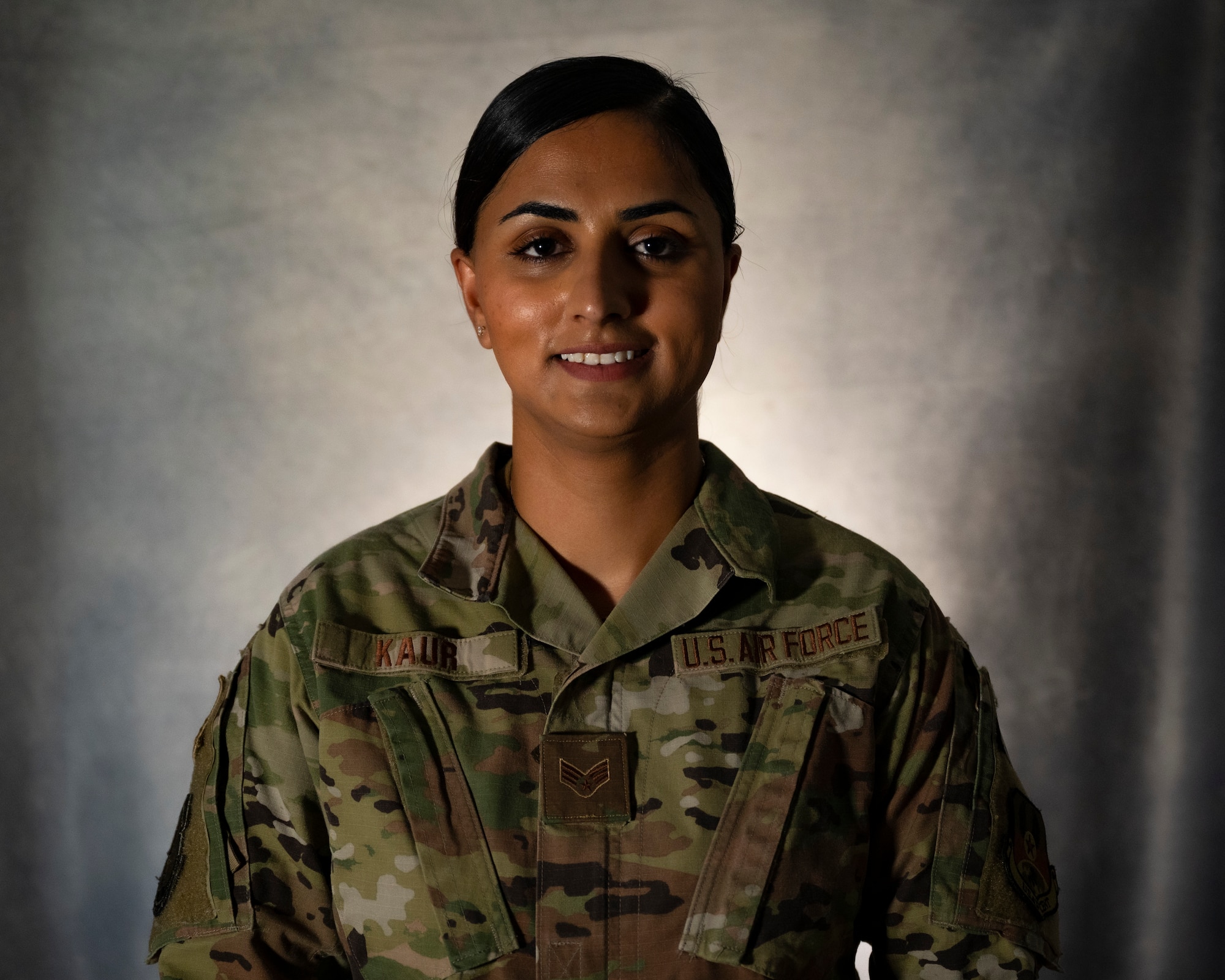Senior Airman Ramandeep Kaur, assigned to the Office of Special Investigations 242nd Detachment Locally Employed Persons Screening Team, poses for a photo at Ali Al Salem Air Base, Kuwait, Oct. 19, 2021.