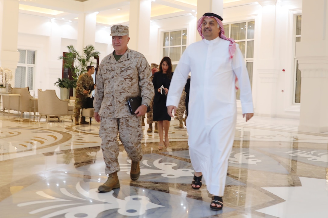 Gen. Kenneth F. McKenzie Jr. (left), the commander of the United States Central Command, walks with Dr. Khalid Bin Mohamed Al Attiyah (right), Qatar Deputy Prime Minister and Minister of State for Defense Affairs, during a meeting in Qatar, Oct. 21, 2021. (U.S. Army photo by Staff Sgt. John Onuoha, United States Central Command)