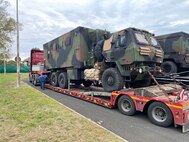 A contracted line haul truck driver inspects his load at a rest stop in route from Zutendaal, Belgium, to Leghorn Army Depot, Italy. To date, more than 150 trucks have transported over 2,000 pieces of Army Prepositioned Stock-2 equipment and vehicles from three APS-2 worksites north of the Alps to south of the Alps to support the new APS-2 theatre strategy and to provide capabilities to best support two Defense Department Combatant Commands. Over the next month, the APS-2 worksite at Leghorn Army Depot expects to receive about 4,000 more pieces of APS-2 equipment and vehicles. (Photo by Army Sgt. 1st Class Kavan Norris)