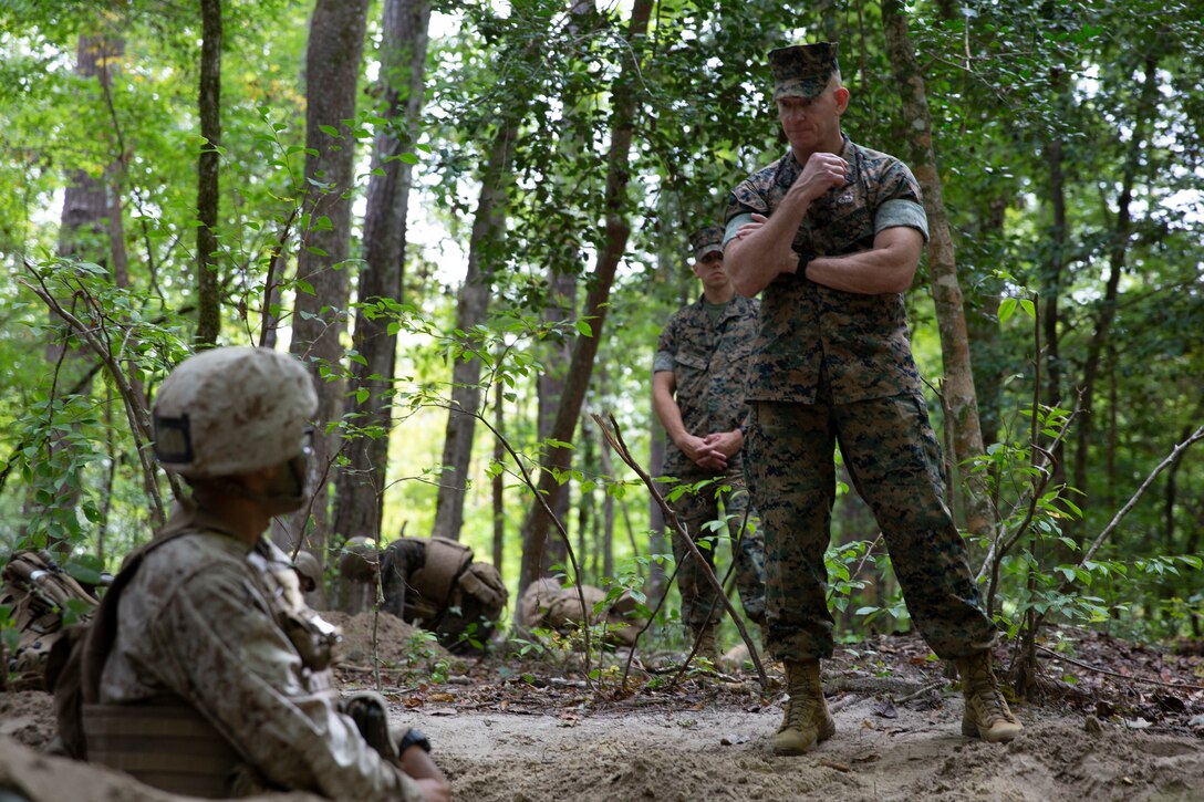 U.S. Marine Corps Sgt. Maj. Troy E. Black, right, Sergeant Major of the Marine Corps, speaks with a student in Marine Combat Training at Camp Devil Dog, North Carolina, Oct. 6, 2021.