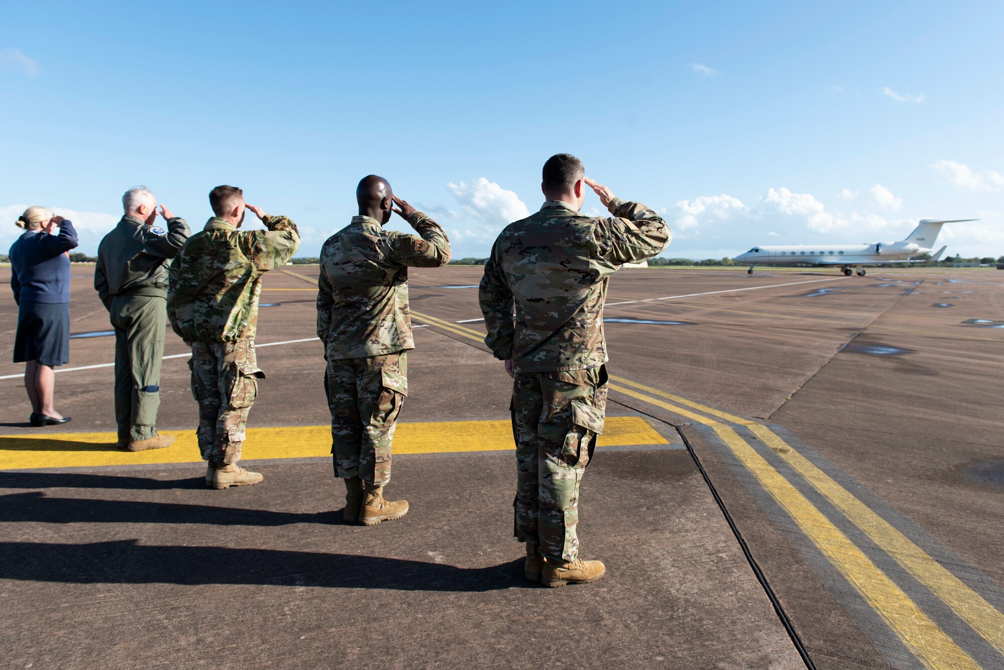 U.S. Air Force Col. Brian Filler, right, 501st Combat Support Wing commander, Chief Master Sgt. Ralph Oliver, second right, 423rd Air Base Group command chief, U.S. Air Force Col. Jon Hannah, center, 422nd Air Base Group commander, U.S. Air Force Col. Charles Metrolis, second, U.S. Embassy U.S. Defense Air Attaché, and Royal Air Force Sq. Ldr. Jayne Robertson, left, RAF commander for RAF Fairford, welcome Admiral Charles “Chas” Richard, U.S. Strategic Command Commander, during a visit to Royal Air Force Fairford, England, Oct. 20, 2021. Richard visited Fairford to to immerse with Airmen from the 9th Expeditionary Bomb Squadron who are temporarily stationed at Fairford for a BTF deployment. USSTRATCOM forces are on watch 24 hours a day, seven days a week to deter and defeat attacks against the U.S. and our allies. (U.S. Air Force photo by Senior Airman Jennifer Zima)