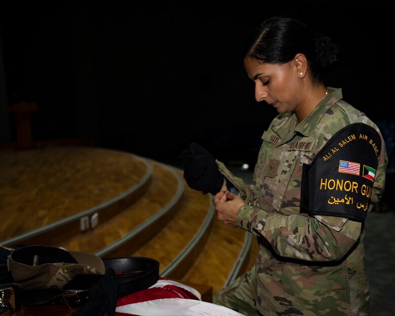 Senior Airman Ramandeep Kaur, assigned to the Office of Special Investigations 242nd Detachment Locally Employed Persons Screening Team, prepares for honor guard practice at Ali Al Salem Air Base, Kuwait, Oct. 19, 2021.