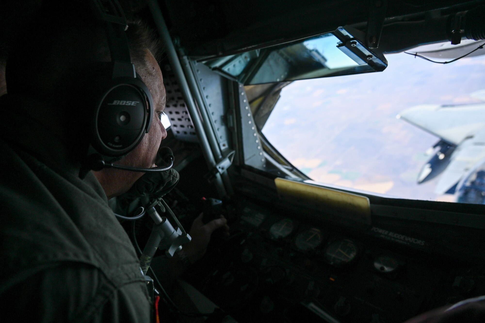 Chief Master Sgt. Steven Robinson, 465th Air Refueling Squadron boom operator, refuels an F-15 during a training sortie from Tinker Air Force Base, Oklahoma, Oct. 15, 2021. (U.S. Air Force photo by 2nd Lt. Mary Begy)